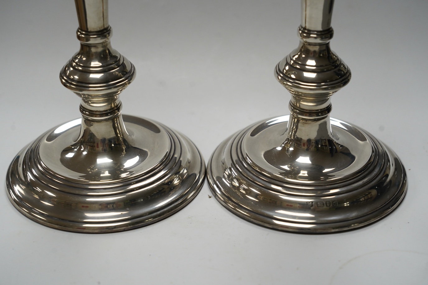 A pair of Elizabeth II silver candlesticks, with turned columns, London, 1958 (maker's marks rubbed, height 20.8cm, weighted. Condition - fair